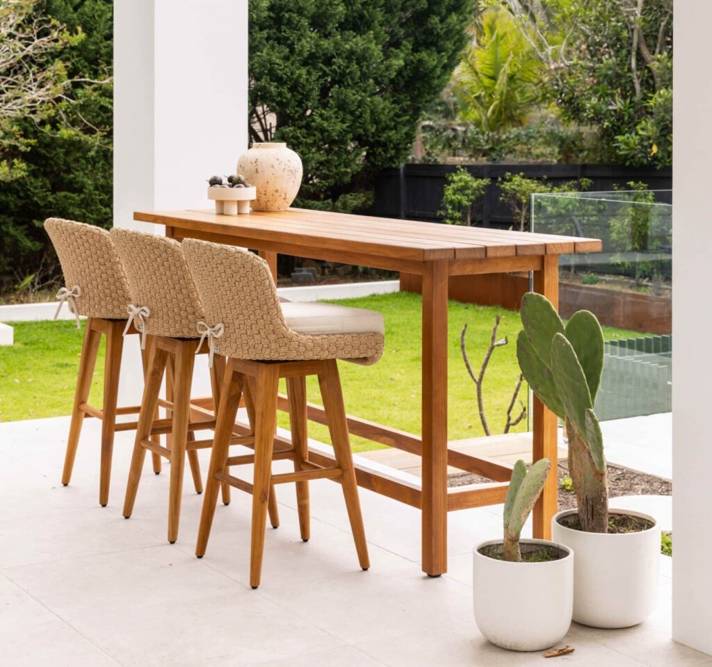 Armless wicker bar stools at an outdoor bar table